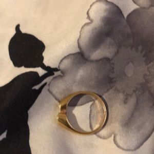 It’s just a gold ring with 2 fake stones in it